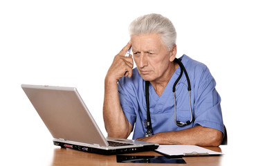 Elderly doctor with  laptop