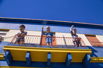 Buenos Aires, Argentina - August 16, 2017: Decorative dolls on balconies of calle caminito in the...
