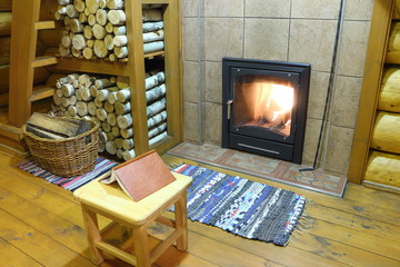 Part of the room interior with a fireplace in the country house.