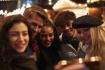 Young Friends Posing For Selfie At Christmas Market
