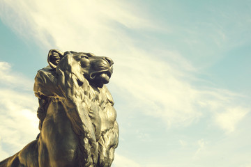 Detail of statue of a king lion, which belongs to Christopher Columbus monument. It is located in...