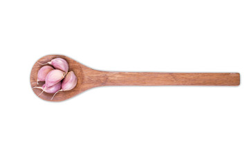 Fresh garlic on wooden spoon isolated on white background
