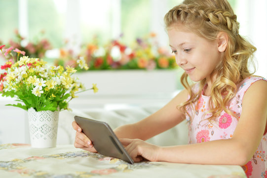 little girl with tablet