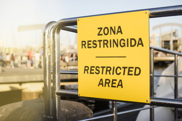 Restricted area signboard, written in Spanish and English