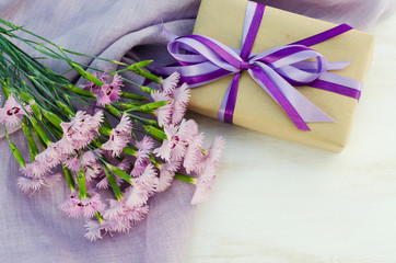 Obraz na płótnie Canvas Present or gift box and tender flowers