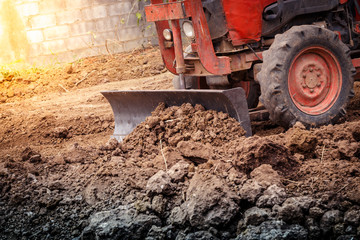 The tractor working on the large field
