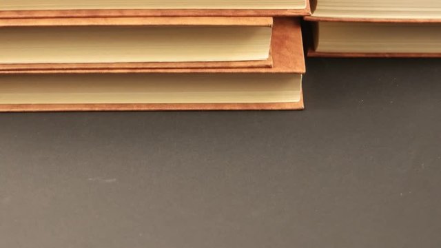 Brown books move in the horizontal plane