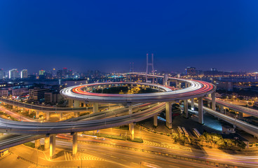 Fototapeta na wymiar Modern bridge at Night in Shanghai,China