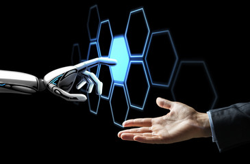 human hand and robot touching network hologram