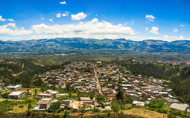 Obraz premium Beautiful landscape of the city surrounding of mountains, to visit municipal dump in a beautiful day, in the city of Quito, Ecuador