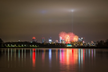 Light to heaven and fireworks over the Warsaw, Poland