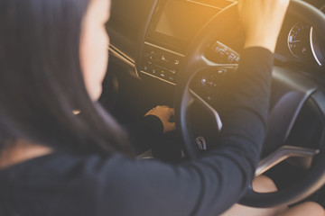 Hands woman holding steering wheel and on automatic gear shift ,Driving a car