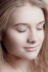 Obraz premium Nude makeup on the eyes closed girl with clean skin closeup