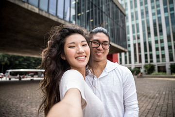 Fototapeta premium Asian Couple Taking a Selfie