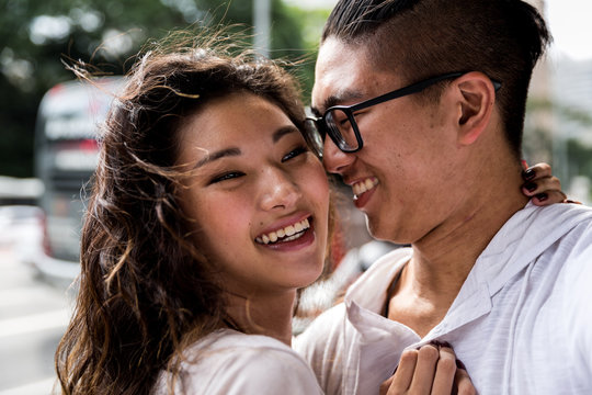 Young Asian Couple Embracing