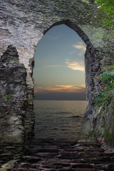 Looking at the sunset over the stone gate
