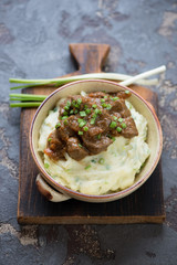 Traditional Irish champ served with beer and beef stew, one of the meals for Saint Patrick’s Day, selective focus, vertical shot