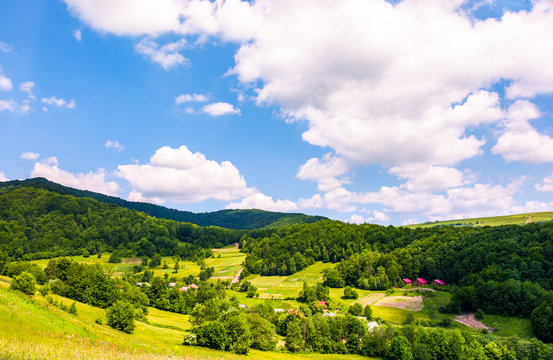 village in Carpathian mountains in summertime. lovely rural scenery under the blue sky with clouds