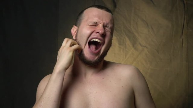 The man shows an orgasm, slow motion