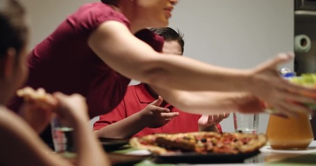 Mother Giving Salad Instead Of Pizza To Overweight Son