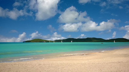 Fototapeta na wymiar Sailboats on turquoise Caribbean water