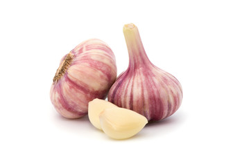 Garlic with leaves of parsley isolated on white