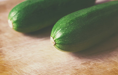 close view zucchini on wooden surface