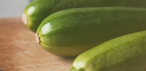 close view zucchini on wooden surface