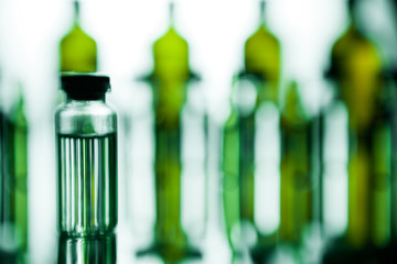 Group of ampoules with a transparent medicine in medical laboratory