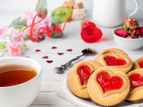 Homemade Cookies with a Red Jam Heart Valentine's Day Cup of tea