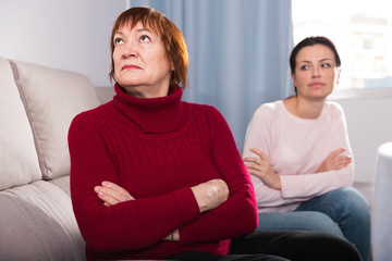 Portrait upset adult women looking away after conflict