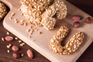cookies with peanuts, wooden board, nuts