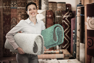 Female touching and choosing carpets