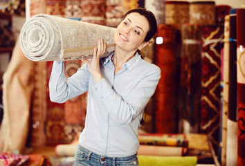woman consumer holding carpet