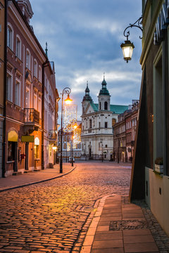 Pauline church of St. Spirit and Freta street at night on the old town in Warsaw, Poland