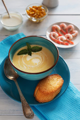 Bowl of cream soup with shrimps and spoon