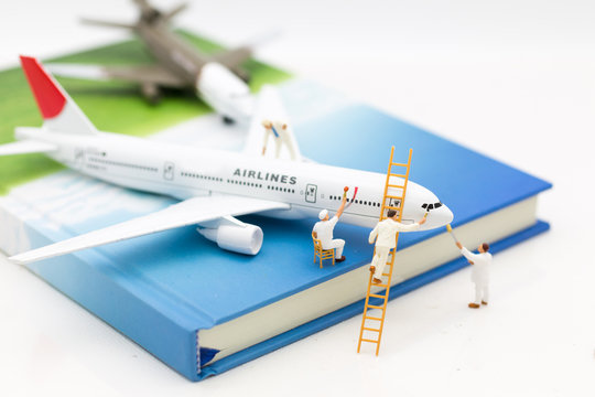 Miniature people: Group worker are repairing the plane. Image use for maintenance, Improvement, business concept.
