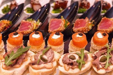 Shrimp with olives, cheese with grapes and canapes with meat. Cocktail Reception