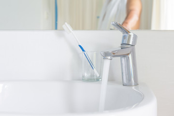 chrome basin faucet. water valve, interior of bathroom