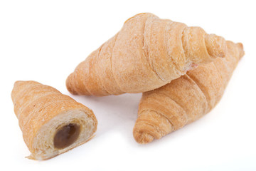 croissant with condensed milk isolated on a white background