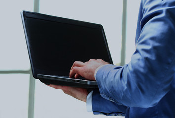 Businessman using laptop in the office.