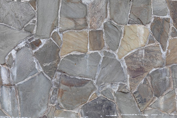 wall from Grey stones  with color tone in cement  texture background