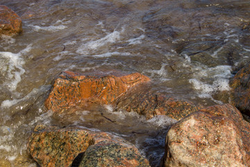 Sea waves splashing over rocks