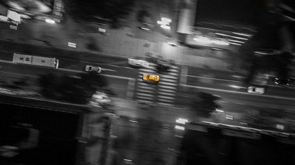 Drone view of a car in focus and blurred background. aerial blur motion