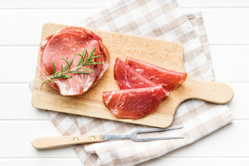 Sliced prosciutto crudo.