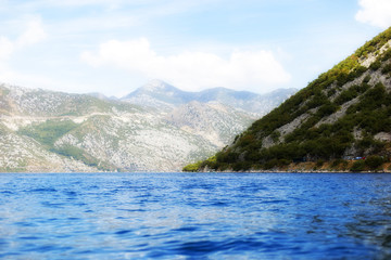 blue sea with mountain views