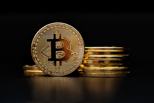 crypto currency bitcoin golden representation on black background