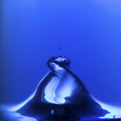 Blue water spiral of water swirling around in studio