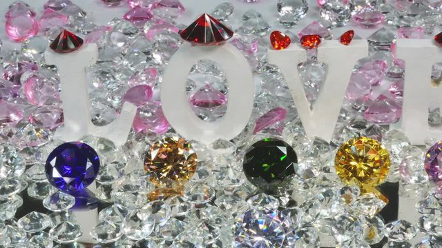 the word Love written by colorful diamonds in white background for valentine day