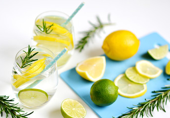 Glasses with Fresh Water Rosemary Lemon Lime Fruits White Background Beverage Healthy Lifestyle